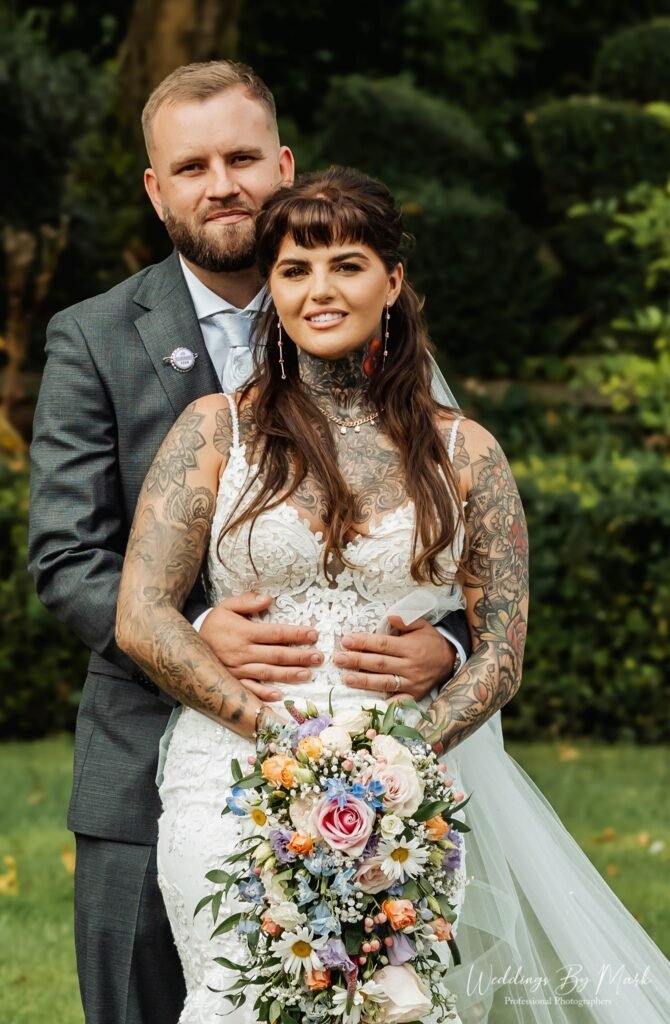Stylish bride and groom portrait in the gardens of Moxhull Hall, Sutton Coldfield.