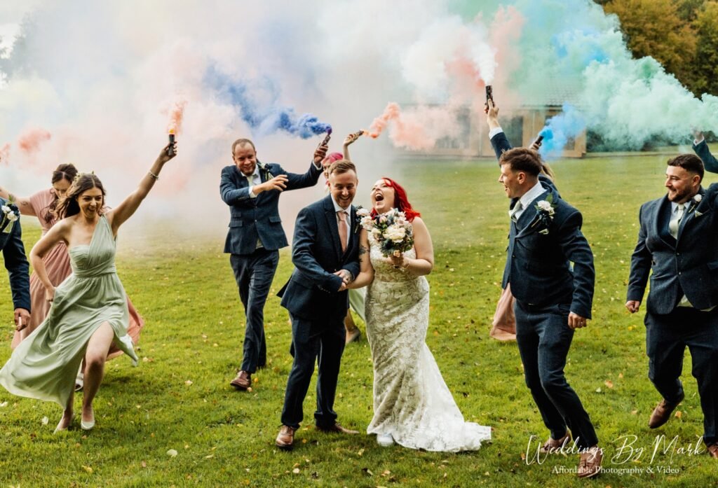 Creative smoke bomb wedding photography at The Hidden Hive, Derbyshire. A cool, festival-style portrait of the bride and groom.