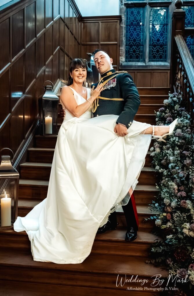 Bride and groom portrait on the grand staircase at Standon Hall, Staffordshire