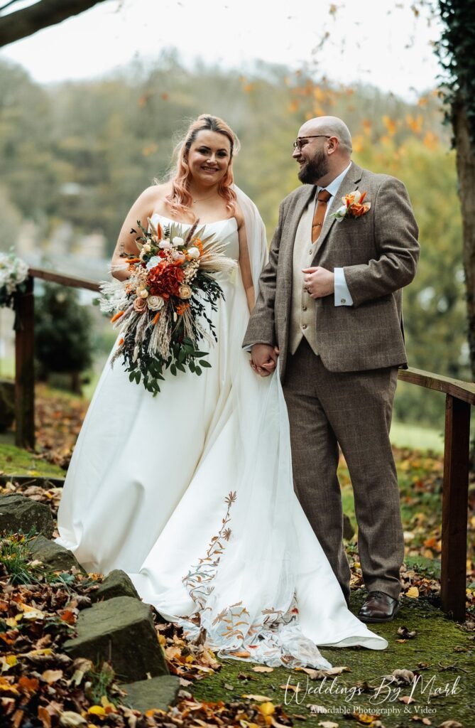 Intimate wedding couple portrait using the historic architecture of Hollin House for shelter.