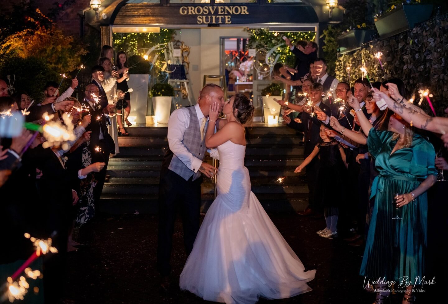 Magical wedding sparkler exit at night outside the Grosvenor Pulford Hotel & Spa, Chester