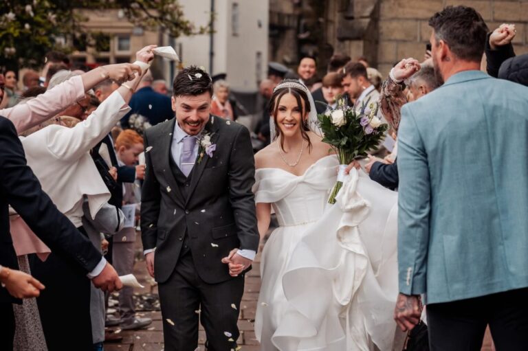Joyful confetti moment leaving the church ceremony before heading to Stirk House wedding reception.