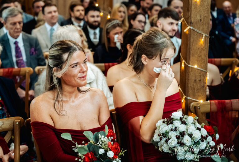 Emotional guests wiping tears during the ceremony, capturing the real moments at The Oak Tree of Peover