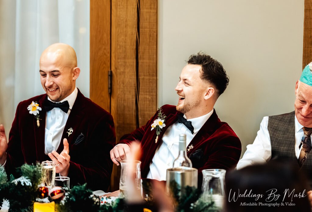 Here are the final images from this batch, listed in numerical order based on their filenames: 27. Speeches & Laughter The groom, looking sharp in his red velvet jacket, is captured laughing heartily at the head table, likely reacting to a funny moment during the speeches