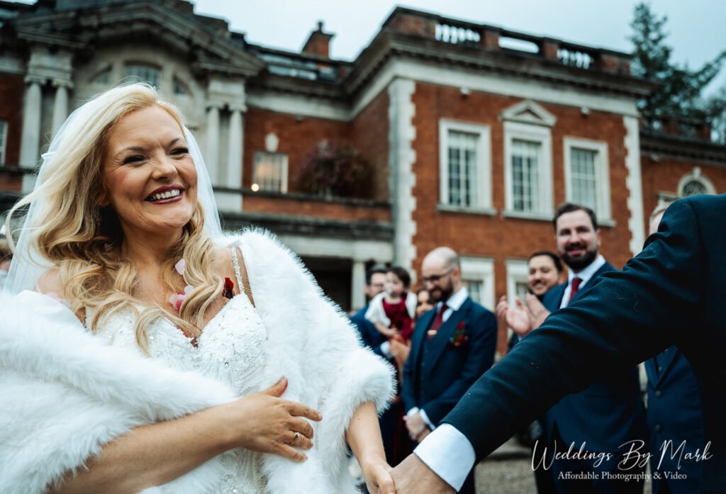 Maria and Jonny in the Lancashire winter light outside Eaves Hall, Lancashire wedding photography.