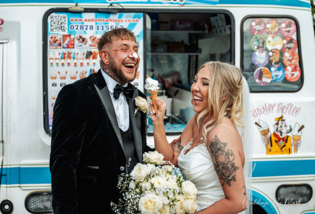 A couple enjoying & laughing on their wedding day, photographed by Weddings By Mark