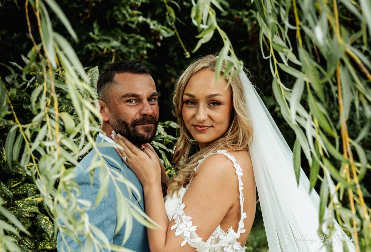 Tash and James beneath the willow branches at The Higher Trapp Hotel